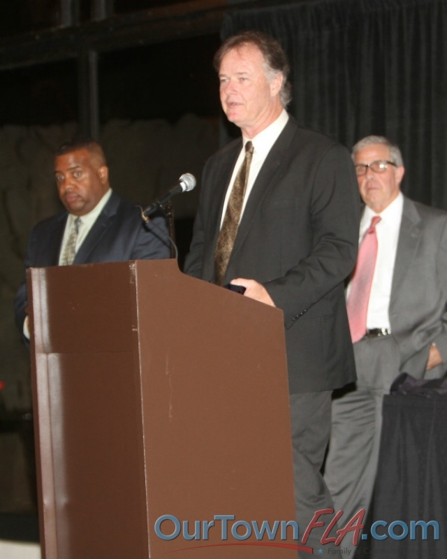 Kenny Freeman, husband of the late Cindy Freeman, accepts the first 'Spirit of Business' Award from the Greater Wesley Chapel Chamber of Commerce, named in Cindy's honor.